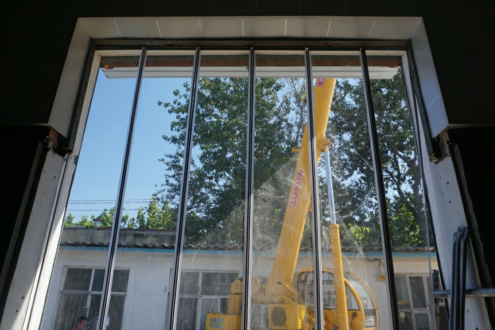 Forklift driving effortlessly through a magnetic PVC curtain, showcasing streamlined workflow.